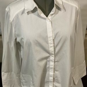 White long sleeve Button up shirt with pockets.